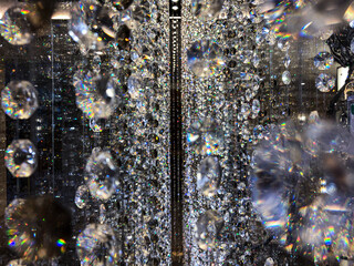 Crystal elements of modern design chandelier hanging in rows from the ceiling like stars in the sky...