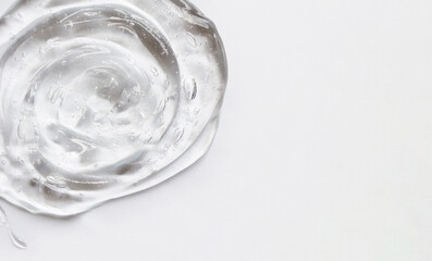 Gel texture of the emulsion on a white background. Clear cream and copy space.