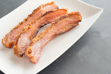 slice of bacon on plate