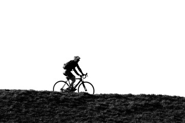 Fototapeta premium woman on bike on top of dike in holland
