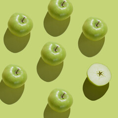 Pattern with fruits. Tropical abstract background. Fresh Green Apple on Green background. Fruits pattern, top view, flat lay.
