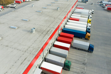 transport near the cargo terminal, delivery of products and goods. View from a drone on a sunny day.