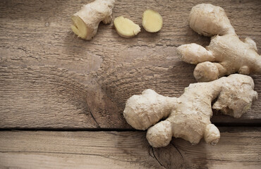 raw ginger on old wooden background