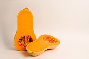 Cut in half Butternut squash isolated on white background. Healthy food.Vegeterian concept.Vitamin C and K