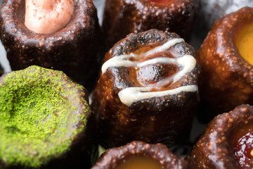 Caneles de bordeaux is a small pastry with rum and vanilla, traditional French sweet dessert.
