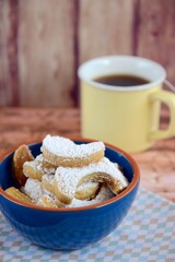 Putri Salju or crescent-shaped cookies coated with powdered sugar. Traditional Indonesian cookies to celebrate Eid al Fitr