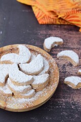 Putri Salju or crescent-shaped cookies coated with powdered sugar. Traditional Indonesian cookies to celebrate Eid al Fitr
