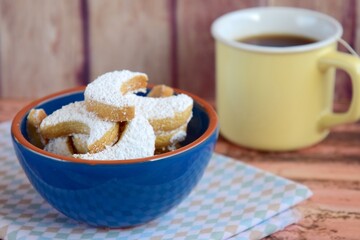 Putri Salju or crescent-shaped cookies coated with powdered sugar. Traditional Indonesian cookies to celebrate Eid al Fitr