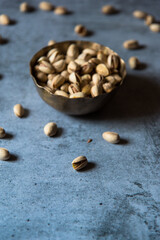 Pistachios in a bowl with use of selective focus 