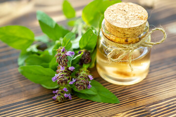 Prunella vulgaris, self-heal, carpenter's herb purple flower tincture in bottle ready for drying and making tea and infusions. Useful herb for use in cosmetology and alternative medicine