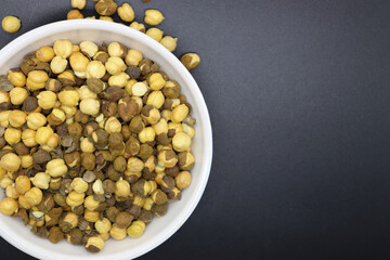 roasted chana with sweet kheel or chikpeas Bengal Grams also known as chatpata futana or Phutana flavored with spicy Indian Masala mithi sheel