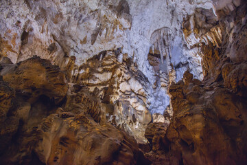 Underground cave, amazing scene , view of stalactites and stalagmite underground , formation inside.