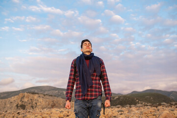 Naklejka premium Portrait of handsome hiker man smiling looking up.