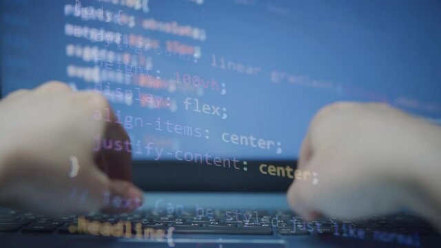 HTML coding at the laptop. Concept of Hacking programming. Typing the code on the laptop Keyboard 