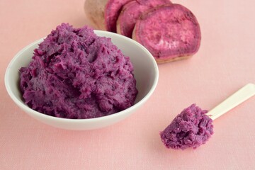 Mashed purple sweet potato in a bowl