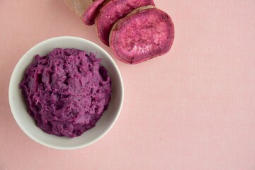 Mashed purple sweet potato in a bowl