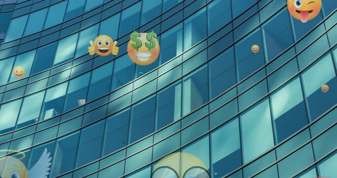 Animation of emoji icons flying up over modern office building