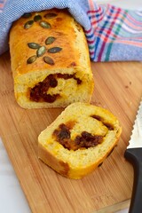 Pumpkin loaf bread with pumpkin seeds and raisin cinnamon sugar filling