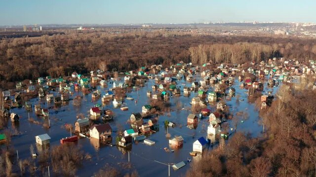 The river overflowed its banks and flooded a village in Bashkiria. An overhead view of the consequences of an ice explosion on water bodies. Drone footage. High quality.