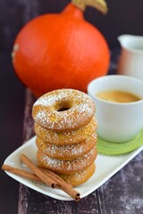 Pumpkin donuts with a cup of coffee