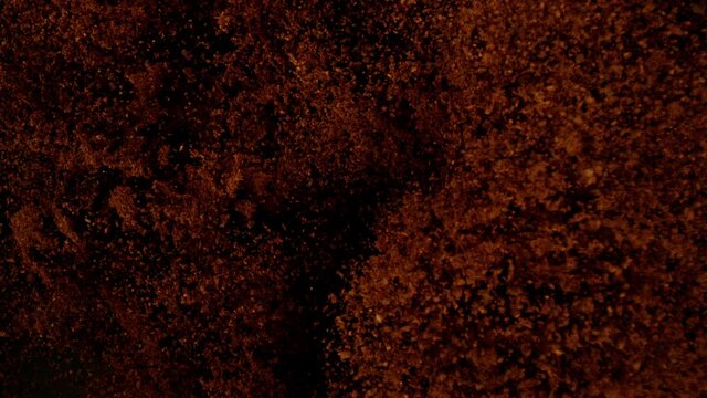 Super slow motion of flying ground coffee. Filmed on high speed cinema camera, 1000 fps.