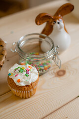 little Easter cake on the wooden table of the house
