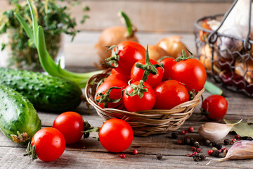 Tiny cherry tomatoes (ciliegini, pachino, cocktail). group of cherry tomatoes on wooden background. Ripe and juicy cherry tomatoes