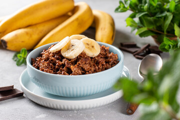 Chocolate oatmeal in white bowl for breakfast