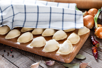 Sculpt dumplings. Dumplings with minced meat sculpts cook in the kitchen. Prepare homemade...