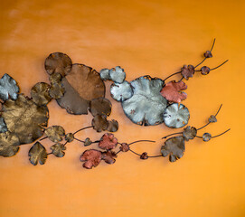 Decorative with Lotus leaf pattern made from metal on orange .background.