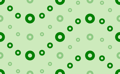 Seamless pattern of large and small green record media symbols. The elements are arranged in a wavy. Vector illustration on light green background