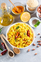 Lemon rice with curry leaf and with green chili, served in a ceramic bowl, selective focus