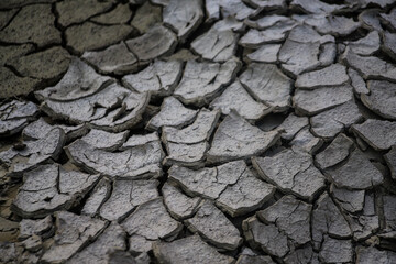 DROUGHT EROSIONED EARTH WITH CUTTING TEXTURE