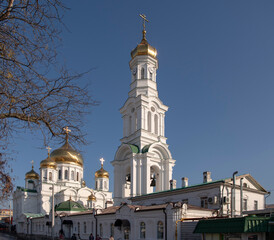 Fototapeta na wymiar Rostov Cathedral of the Nativity of the Blessed Virgin. Citizens walk near the cathedral