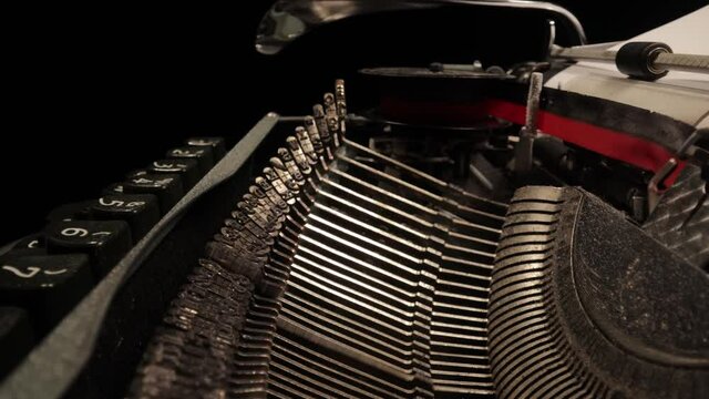 Writing a letter on an old typewriter - very nostalgic - probe lens close up shot