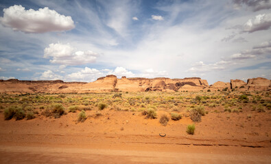 Naklejka na ściany i meble Stunning views of Oljato-Monument Valley Utah on a partly cloudy day