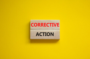 Corrective action symbol. Wooden blocks with words 'Corrective action' on beautiful yellow background. Business and Corrective action concept. Copy space.