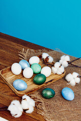 Obraz premium Easter church holiday colorful eggs on chalkboard and blue background