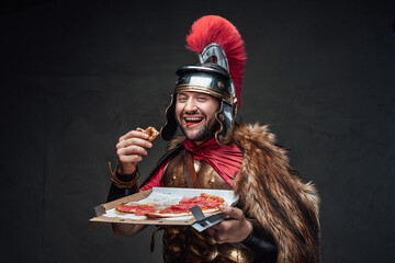 Joyful soldier of ancient rome with pizza