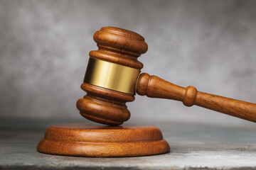 Judges gavel or auction gavel on the table close-up.