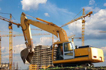 Construction machine (excavator) on the background construction site, industrial image. Moscow, Russia