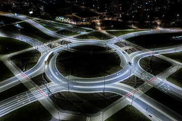 Arial top view of Modern transportation with Expressway, Road and Roundabout,Road traffic, multilevel junction highway-Top view in asia. Important infrastructure for transport.