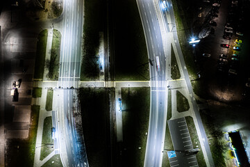 Arial top view of Modern transportation with Expressway, Road and Roundabout,Road traffic, multilevel junction highway-Top view in asia. Important infrastructure for transport.