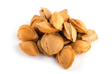 bunch of apricot seeds on the white foot. Apricot bones, close-up