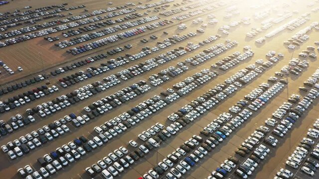 Aerial view of the dealership cars export or customs terminal in export and import business and logistics with a rows of new vehicles