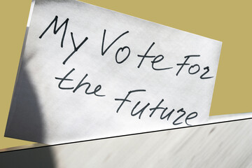 white paper with "My vote for the future" inscription dropped in a white box. This ballot has the message: Vote. Make a choice image concept.