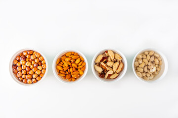 Process of soaking various nuts: almonds, hazelnuts, cashew, brazilian nut in water to activate. Home Cooking: making plant based organic veggie Milk, lactose free.