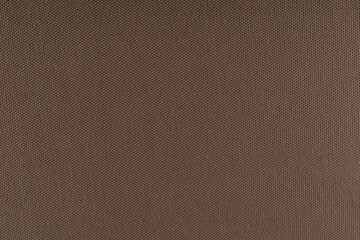 Fototapeta na wymiar smooth surface of dense curtain cotton fabric of coffee color, background, texture