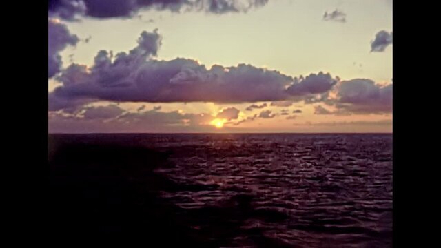 Touristic cruise by boat in Egypt, mediterranean sea at sunset. Historical archival of Egypt in 1980s.