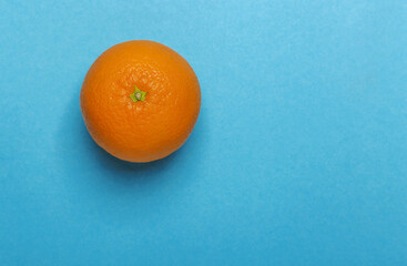 Orange fruit or orange on a blue background.
